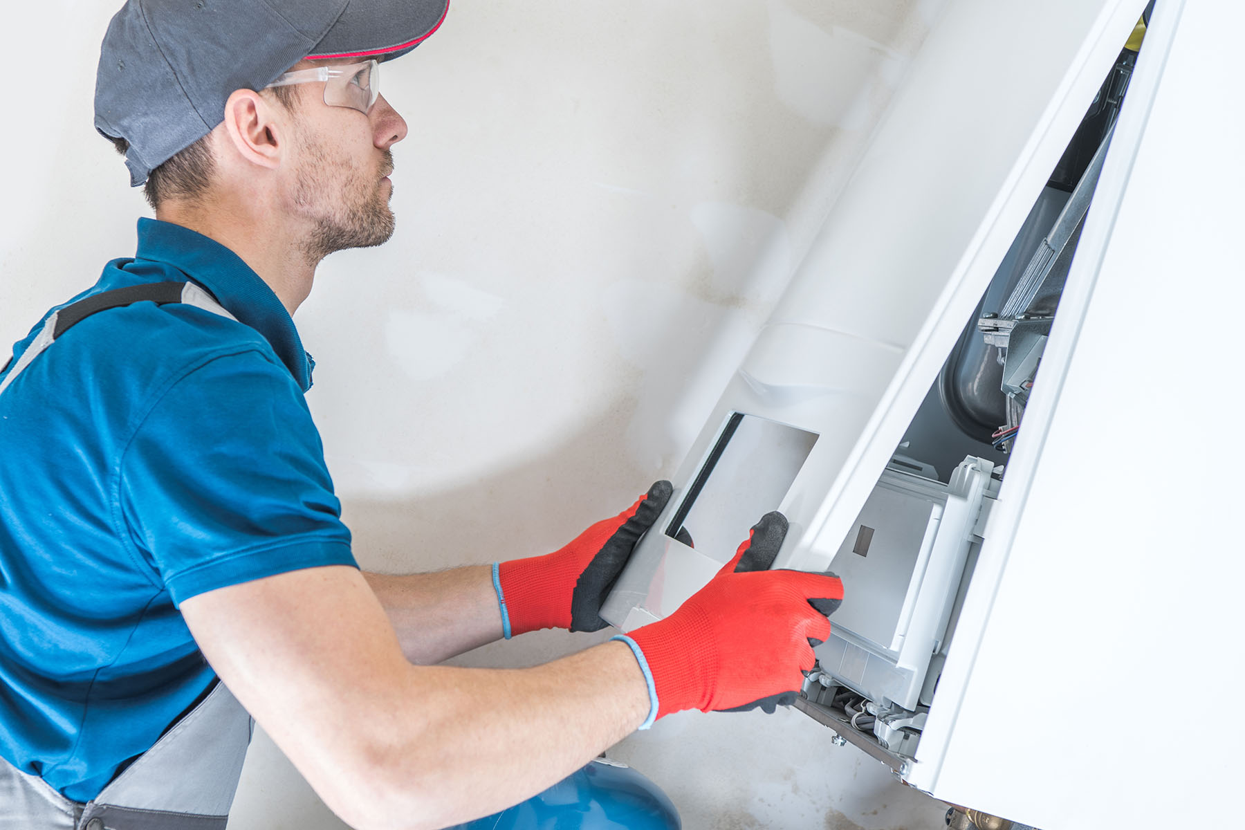 Comfy Home Services technician working on home comfort equipment